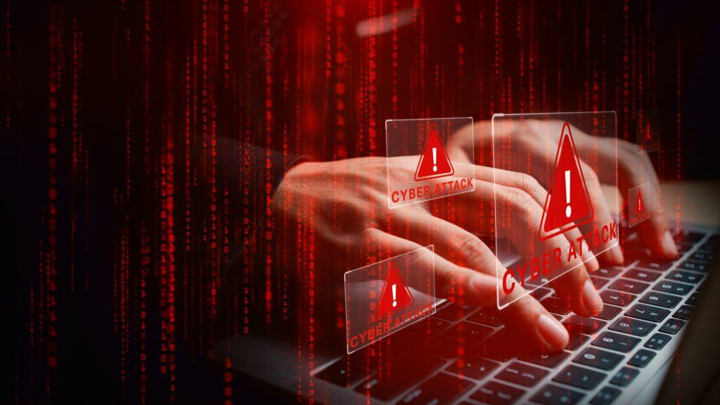 Laptop,With,Hands,Typing,Amid,Glowing,Cyber,Attack,Alerts,And